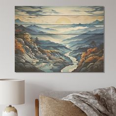 a painting hanging on the wall above a bed in a room with a lamp and pillows