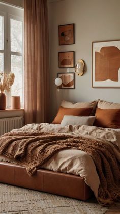 a bedroom with a large bed and lots of pillows