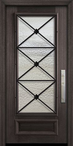 the front door is made from wood and has glass panels on each side, along with a metal handle