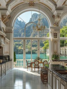 a large kitchen with an arched ceiling and marble counter tops, along with two dining chairs