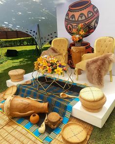 an assortment of wooden furniture on display in a garden area with grass and flowers behind it