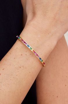 Rainbow-colored cubic zirconia add bold shine to a bangle bracelet finished in bright polish for eye-catching appeal. 0.25" width 18k-gold plate or rhodium plate/cubic zirconia Imported Festival Must Haves, Bracelet In Silver, Rainbow Jewelry, Love Bracelet, Winter Sneakers, Flip Flop Slippers, Cartier Love, Cartier Love Bracelet, Heeled Loafers