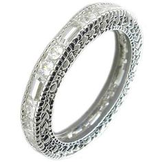 Zirconite Cubic Zirconia Sterling Silver all around Filigree Designer style Eternity band Ring 501R23516 Meticulously crafted in Sterling Silver as fine jewelry and Electroplated w/Rhodium for that Look-of Real finish. Zirconite stones alternate Rounds & Baguettes. Also available in alternating colors of: Ruby/Clear, Emerald/Clear, Sapphire/Clear, Pink/Clear, Lavender/Clear. Cubic Zirconia Rings Eternity Bands, Luxury Cubic Zirconia Engagement Bands, Luxury Wedding Engraved Ring With Cubic Zirconia, Luxury Cubic Zirconia Band, Luxury Cubic Zirconia Filigree Ring In Diamond White, Luxury Cubic Zirconia Bands With Prong Setting, Luxury Delicate Cubic Zirconia Rings, Luxury Halo Cubic Zirconia Eternity Band, Luxury Everyday Cubic Zirconia Rings