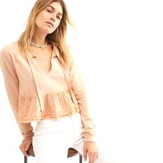 New with tags! Free People Sweet Jane Pullover Sweatshirt Top Style: OB 910894 Color:  Shell Pink (peachy pink) Size: Large Retail $78   Soft and comfy pullover featuring a washed cotton peplum hem V-neckline Slouchy, boxy silhouette. Raw trim. Approximate Measurements (Stretchy fabric, so measurements are approximate): Length: 20” Pit to pit: 22” Cotton / polyester / viscose blend Hand wash cold or dry clean Shell Pink, Cropped Sweatshirt, Peplum Hem, Cotton Viscose, Peachy Pink, Ribbon Tie, Crop Sweatshirt, Tie Neck, Department Store