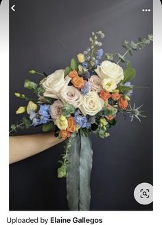 a person holding a bouquet of flowers in their hand with the caption uploaded by elane galloos