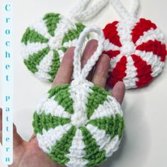 two crocheted ornaments are being held by someone's hand