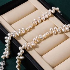 Celebrate your inner goddess with our stunning 18-inch White Freshwater Pearl Necklace, inspired by the timeless elegance of the olive branch. This necklace boasts exceptional freshwater pearls, each meticulously selected for their excellent luster, clean surface, and perfect matching. With pearls sized 7-8mm in an elegant oval shape, it’s designed to illuminate your everyday style, inspiring beauty and elegance from every angle. Product Details: Pearl Type: Freshwater Pearls Pearl Size: 7-8mm P Pearl House, The Olive Branch, Large Pearl Earrings, Rice Pearls, Black Pearl Necklace, Pearl Jewelry Necklace, Inner Goddess, Pearls Necklace, Purple Pearl