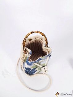 BirdinBag - Fashionable Mini Bucket Bag with Floral Embroidery, Drawstring Closure & Sequin Decoration Embroidered Bucket Bag For Daily Use, Embroidered Beige Bucket Bag, Beige Embroidered Bucket Bag, Daily Use Embroidered Bucket Bag, Embroidered Bucket Bag For Travel, Embroidered Bucket Bag Pouch For Travel, Embroidered Pouch Bucket Bag For Travel, Embroidered Pouch Bucket Bag For Everyday Use, Travel Bucket Bag Embroidered Pouch