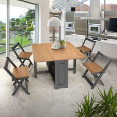 a kitchen table with four chairs next to an oven and refrigerator in the back ground