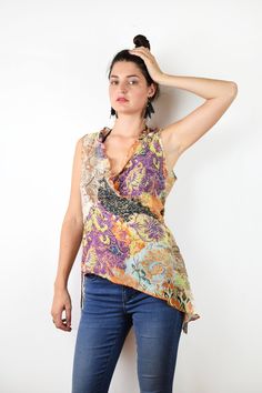 Floral asymmetrical blouse In great condition Tag: Labod Material: 68% cotton, 32% silk Size: Eu 42, medium, large bust 41 cm = 16 in length 56 cm = 22 in waist 40 cm =15,5 in Thank you for your visit! View more products: https://www.etsy.com/shop/VintageSeventhHeaven Feel free to contact me if you have any questions. Fitted Multicolor Asymmetrical Top, Sleeveless Purple Cotton Blouse, Purple Cotton Sleeveless Blouse, Bohemian Summer Tops With Asymmetrical Hem, Bohemian Tops With Asymmetrical Hem For Summer, Bohemian Blouse With Asymmetrical Hem For Summer, Multicolor Asymmetrical Hem Tops For Summer, Summer Bohemian Asymmetrical Top, Sleeveless Orange Cotton Blouse