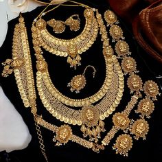 A splendid matte finish complete bridal set apt for the beautiful bride who wants to look traditional and homely, to match her wedding lehenga and bridal wear consisting of 17 items Specialty: Hindu Goddess Lakshmi  Material: Gold matte, copper& brass  Finish: Matte Finish Contents: 1 Necklace 1 Long Haram 2 Mattal Earrings 1 Maang Tikka 1 Hip Chain 2 Baajubandhs 9 Jadai Billai (Hair Jewelry) 📦What are you waiting for! Order now and lets your bride ready.📦 Festive Gold Brass Bridal Necklace, Gold Brass Bridal Necklace For Festivals, Festive Bridal Brass Necklace With Tilla, Gold Matha Patti Bridal Jewelry, Dulhan Bridal, Luxury Traditional Brass Bridal Necklace, Jadai Billai, Hip Chain, Long Haram