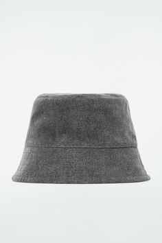 Denim is key for the upcoming season, and this bucket hat from the accessories collection is a subtle way to channel the trend. It's made from a recycled-cotton blend and features a flat crown, tonal stitching along the brim and a full lining so it's comfortable to wear. Recycled cotton is made by converting both pre- and post-consumer fabric into fibers that are then spun into new yarn Shell: 70% Cotton, 30% Recycled cotton (excluding trims) Inner circumference of size XS/S is 22.44", M/L is 23 Belted Cape, Denim Bucket Hat, Accessories Bags Shoes, Denim T Shirt, Accessories Collection, Quilted Bag, The Trend, New Arrival Dress, Recycled Cotton