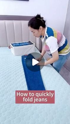 a woman is opening up a mattress with the words how to quickly fold jeans on it