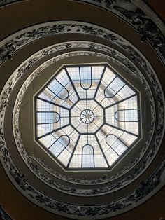 the inside of a building with a skylight in it's center dome, looking up at the ceiling