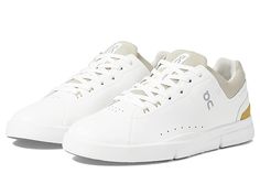 On The Roger Advantage - Men's Shoes : White/Bronze : The third tennis-inspired sneaker to join the On collection co-created with Roger Federer . With its clean lines and minimal stitching, the On The Roger Advantage sneaker demands to be added to your style rotation. All-day wear, versatile. Designed to add a stylish contemporary finish to any ensemble. Engineered for long-lasting cushion and comfort. Approved by the Swiss-Maestro himself. A refreshing aesthetic with athletic accents makes The Sporty White Walking Shoes With Perforated Toe Box, Refreshing Aesthetic, Roger Federer, Shoes White, Clean Lines, Men's Shoes, Tennis, Stitching, Long Lasting