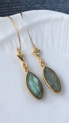 These beautiful labradorite earrings will go with everything. Dainty Gold Earrings With Gemstone Accents, Elegant Labradorite Drop Earrings, Elegant Labradorite Teardrop Earrings, Elegant Labradorite Dangle Earrings, Elegant Labradorite Jewelry For Pierced Ears, Elegant Teardrop Labradorite Earrings, Gold Labradorite Drop Earrings, Handmade Gold Labradorite Earrings, Elegant Handmade Labradorite Earrings