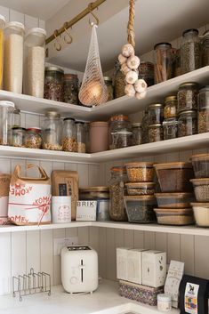 an organized pantry with lots of spices and other items on the shelve shelves