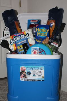 a blue cooler filled with snacks and other items