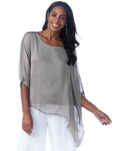 The Martina blouse features elegant silk layers and an asymmetrical hemline, perfectly suited with jeans or pants for an effortless, feminine look. Classic fit—one size fits most Boat neck, three-quarter length sleeves with banded cuffs, asymmetrical silk overlay 100% silk, viscose lining Hand wash, lay flat or hang to dry Made in Italy Suit With Jeans, Silk Overlay, Feminine Look, Silk Top, Boat Neck, Every Woman, Summer Sale, Three Quarter, Lay Flat