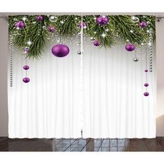 the curtains are decorated with purple ornaments and greenery hanging from it's sides