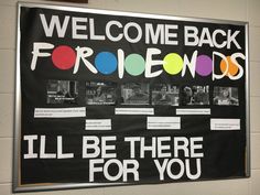 a welcome back sign hanging on the wall in a school hallway with pictures and words