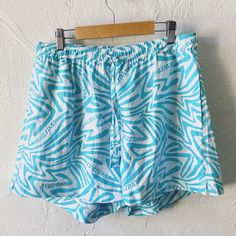 "Holiday linen shorts with side and back pockets and little side slits. Aqua blue and white. Like new. Tagged size XL but flexible, elastic drawstring waist 30~36\" comfortably, rise 13\" hip 49\" inseam 3\"" Blue Linen Shorts For Loungewear, White Drawstring Pajama Shorts For Summer, Blue Beach Shorts With Drawstring, Blue Drawstring Beach Shorts, Bermuda Drawstring Shorts For Beach, Drawstring Bermuda Shorts For Beach, Summer Swim Trunks With Drawstring And Relaxed Fit, White Bermuda Bottoms For Beach Season, Casual Relaxed Fit Shorts For Poolside