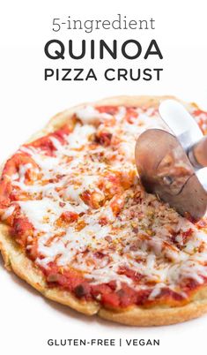 a pizza with cheese and sauce being cut by a chef's knife on a white background