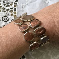 UNIQUE VINTAGE ART DECO DESIGN, VERY LARGE STERLING SILVER BRACELET SET WITH 20 REAL COPPER SMALL BRACELETS. EXCEPTIONAL VINTAGE JEWELRY, UNIQUE DESIGNER, REMARKABLE WORK. VERY IMPOSING BRACELET SET WITH REAL COOPER NUGGETS, SUPERB EFFECT. RARE JEWEL, VERY DESIGN, UNIQUE DESIGNER PIECE. 20 REAL COPPER SMALLS, ALL IN DIFFERENT SHAPE. WIDTH: 33 MM. LENGTH: 17 cm. WEIGHT: 46.4 gr. HALLMARKS: 925. In very good shape. BOX NOT INCLUDED. Antique Silver Hand-cast Bracelets, Antique Silver Oyster Bracelet, Antique Silver Hand Cast Bracelets, Unique Nickel-free Bracelet For Anniversary, Unique Silver Bracelets For Anniversary, Antique Silver Nickel-free Bracelet, Bracelet Set Silver, Large Bracelet, Jewelry Real