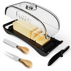 a cheese grater and knife set on a white background with the word butter cut into slices