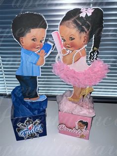 two paper cutouts of children holding hairbrushes and combs in front of a window