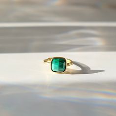 C R Y S T A L ∙ S T A T E M E N T ∙ R I N G This natural Malachite crystal ring, embodies simple elegance and natural beauty. This piece features a large natural Malachite stone on a elegant yet simple gold-plated brass ring.  Malachite is a beautiful banded rich green stone is known for it's ability to support: Healing, Transformation, and Abundance. * Design: Single Stone Crystal Statement Ring * Material & Finish: 18K Gold Plated Brass  * Stone: Malachite * Ring Size: 7 (Adjustable) ** Your ring may vary slightly due to the uniqueness of the stone O T H E R ∙ I N F O R M A T I O N * You will receive your item(s) shipped in a PINK envelope along with custom packaging that includes additional information about the item you've purchased, a jewelry care, and crystal cleansing information. * Adjustable Emerald Ring For Promise, Adjustable Emerald Ring As Gift, Adjustable Bezel Set Emerald Ring Gift, Adjustable Fine Jewelry Emerald Gift Ring, Adjustable Emerald Rings Fine Jewelry, Adjustable Fine Jewelry Emerald Ring As Gift, Adjustable Yellow Gold Emerald Ring Gift, Adjustable Emerald Ring Fine Jewelry For Gift, Adjustable Emerald Ring As Fine Jewelry Gift