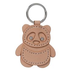 a leather keychain with a teddy bear on it's front and back