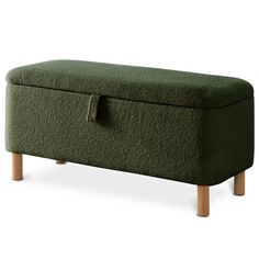 an upholstered bench with wooden legs and a green cover on the top,