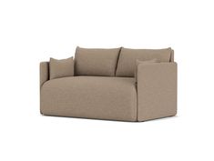 a beige couch with pillows on it