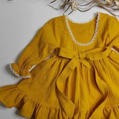 Flowy Yellow Dress With Ruffle Hem, Yellow Baptism Dress For Summer, Yellow Summer Dress For Baptism, Long Sleeve Dress With Bow For Baptism, Flowy Ruffled Dresses For Dress-up Occasions, Yellow Fitted Dress For Baptism, Fitted Yellow Dress For Baptism, Yellow Long Sleeve Ruffled Dress, Cute Flowy Long Sleeve Dresses