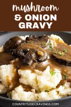 mushroom and onion gravy in a black bowl with mashed potatoes on the side