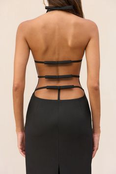 A high neck, halter style maxi dress with a caged back design and back leg slit. — Full length — High neck with halter tie — Caged open back with bow details — Back leg slit High Neck Halter, Cult Gaia, Style Maxi Dress, Halter Style, Back Dress, Active Wear Tops, Sewing Ideas, Kids' Dresses, Evening Wear