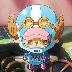 an anime character with glasses and a helmet standing in front of a table full of objects