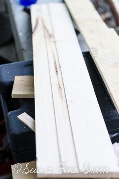 some wooden planks are laying on top of each other and ready to be used