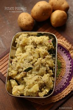 potatoes are in a metal pan on a table