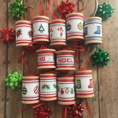 several christmas themed jars with ribbons and bows