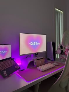 two computer monitors sitting on top of a desk next to a keyboard and monitor screen