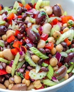 a white bowl filled with beans and veggies