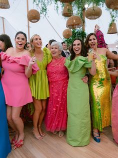 a group of women standing next to each other