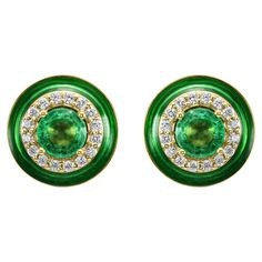 These earrings features a mesmerizing Emerald round center, delicately set and weighing a total of 0.32 carats. The rich green hue of the emerald adds a touch of luxury and timelessness to the design, making it a standout piece in your collection. Surrounding the emerald is a double halo of White Diamond Rounds, totaling to 0.200 carats & Green Enamel. These diamonds are meticulously set to enhance the brilliance of the center stone and add a dazzling sparkle to the earrings. The double halo design creates depth and dimension, enhancing the beauty of the Emerald and creating a mesmerizing contrast against the 18K Yellow Gold setting. Crafted with precision and artistry, these stud earrings also feature Green Enamel detailing, adding a pop of color and a touch of modern flair to the design. Halo Design, American Modern, Double Halo, Yellow Gold Setting, Rich Green, Green Enamel, Gold Fashion, Touch Of Modern, Jewelry Earrings Studs