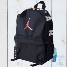 Nwt Nike Air Jordan Jumpman Small Travel Black Backpack With Bottle Pocket Sturdy Woven Fabric For Durability Front Zipper Pocket Provides Easy Access Main Compartment Features Wall Pocket For Small Items Padded And Adjustable Shoulder Straps Zipper Closures 100% Polyester 13" H X 10" W X 5" D Imported. 100% Authentic Guaranteed Item Is Going To Be Shipped Same To 1 Business Day Air Jordan Backpack, Mochila Nike, Nike Backpack, Nike Bags, Black Kids, Black Backpack, Nike Jordan, Small Items, Nike Air Jordan