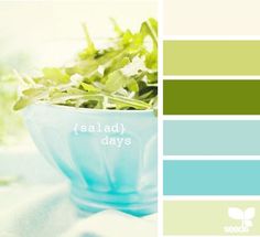 a blue bowl filled with green plants on top of a white tablecloth next to a window