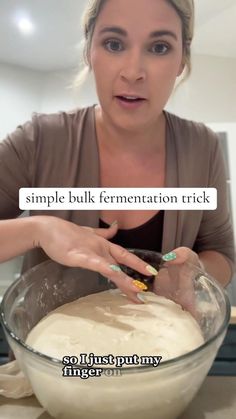 a woman is mixing some food in a bowl with the words, simple bulk fermentation trick