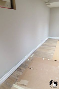 an empty room with hard wood flooring and unfinished paint on the walls in preparation for painting