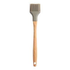 a brush with wooden handle on a white background